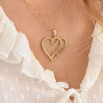 Model wearing heart double-name necklace