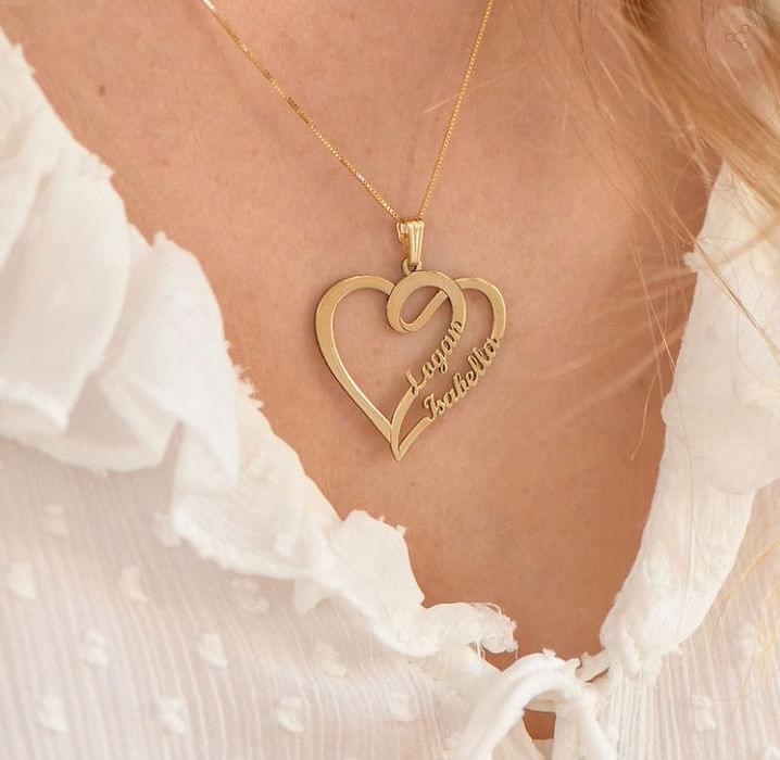 Model wearing heart double-name necklace