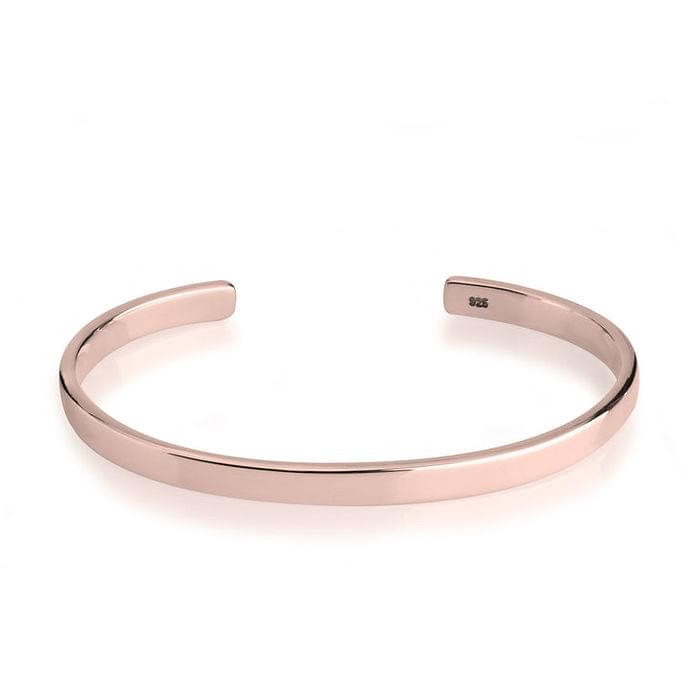 Rose gold bangle on a white background