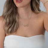 Infinity name necklace with heart worn on neck for size reference