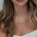necklace with a heart and infinity symbol