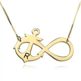 Gold necklace with an infinity symbol and letter 'R'
