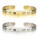 Gold and silver cuff bracelets with engraved coordinates