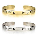 Gold and silver cuff bracelets with engraved coordinates